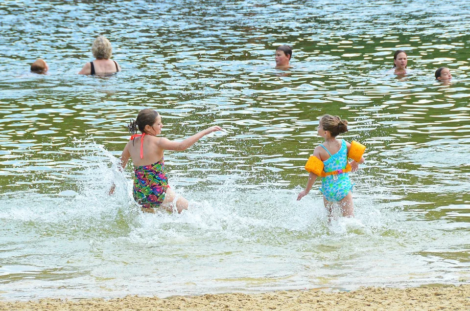 Kids splashing in the lake shallows