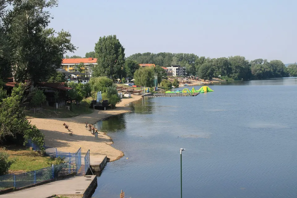 The sandy beach at Silver Lake — floating water park and lakeside cafés